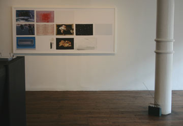 A image of an art piece, with a collage of different images, in an art gallery.