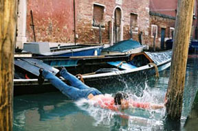 A still of someone falling into water next to a boat.
