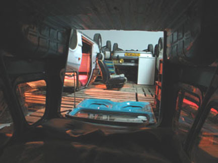 An image shot from within a car interior looking out at other car's exteriors.