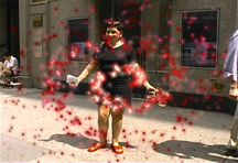 A person standing with their arms out, with edited red sparkles around them.