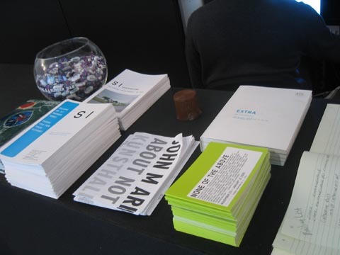 A table with a bunch of different pamphlets.