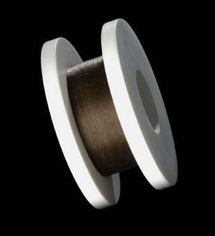 An image of hair wired on a spool.
