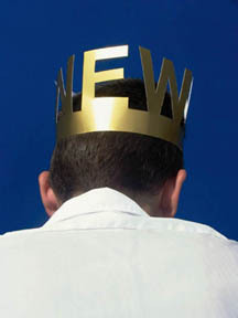 A image of person's head from behind, with a crown on their head that says "NEW".