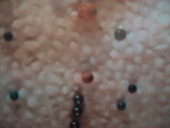 A up-close image of an art piece by Uri Tzaig.