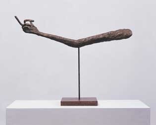A sculpture of an arm with the middle finger sticking out.