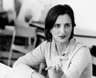 A black and white image of a woman talking.
